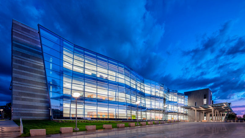 The undulating glass curtain wall of the Omaha VA Ambulatory Care Center resembles the American flag waving in the wind