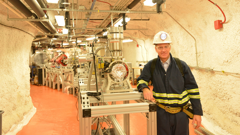 Steven Andersen, AIA, in cavern lab at Sanford Underground Research Facility wearing hard hat