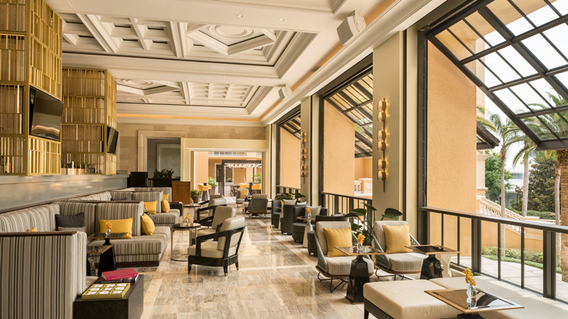 Sunlit lobby with open windows at The Ritz-Carlton Grande Lakes, designed by LEO A DALY
