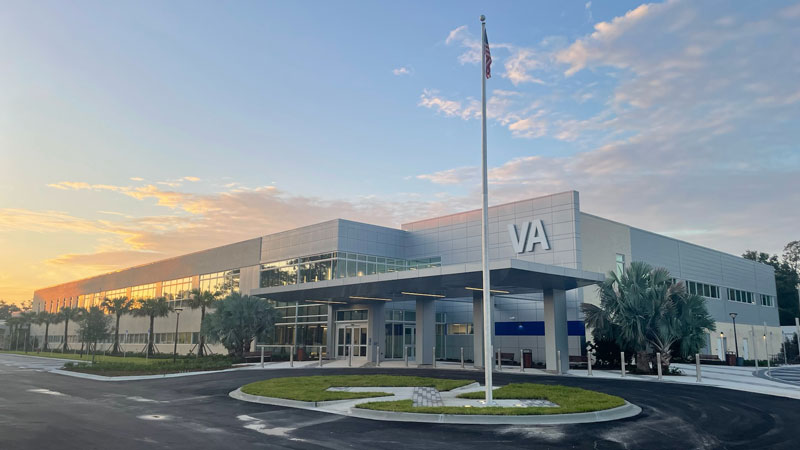 An outdoor image of the Tampa VA facility with the sun setting in the west.